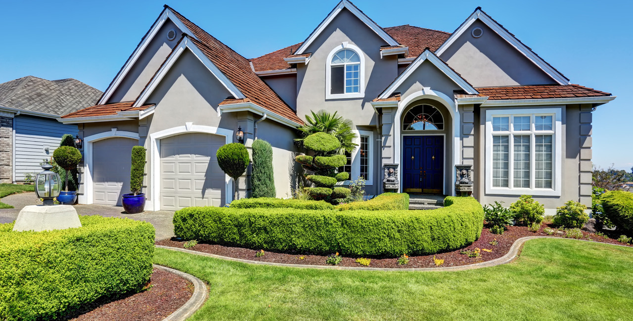 luxury residential house with perfectly kept front garden.